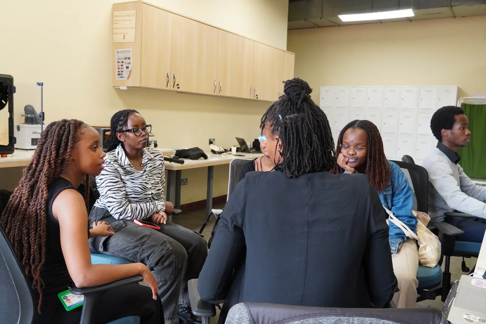 Hackcessible participants seated in a small-group discussion at Aga Khan University